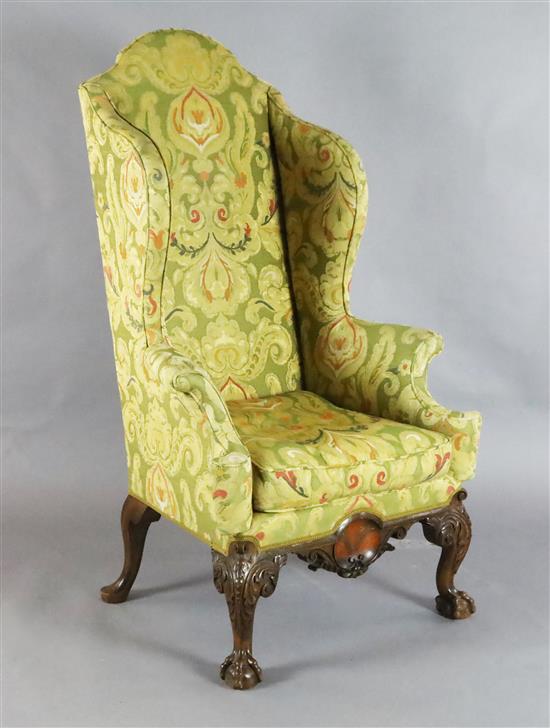 An early 18th century style mahogany wing armchair, W.2ft 8in. D.2ft 8in. H.4ft 9in.